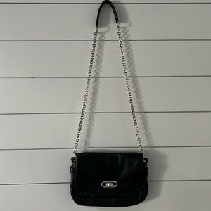 Black coach leather purse with silver chain strap. Very good condition.